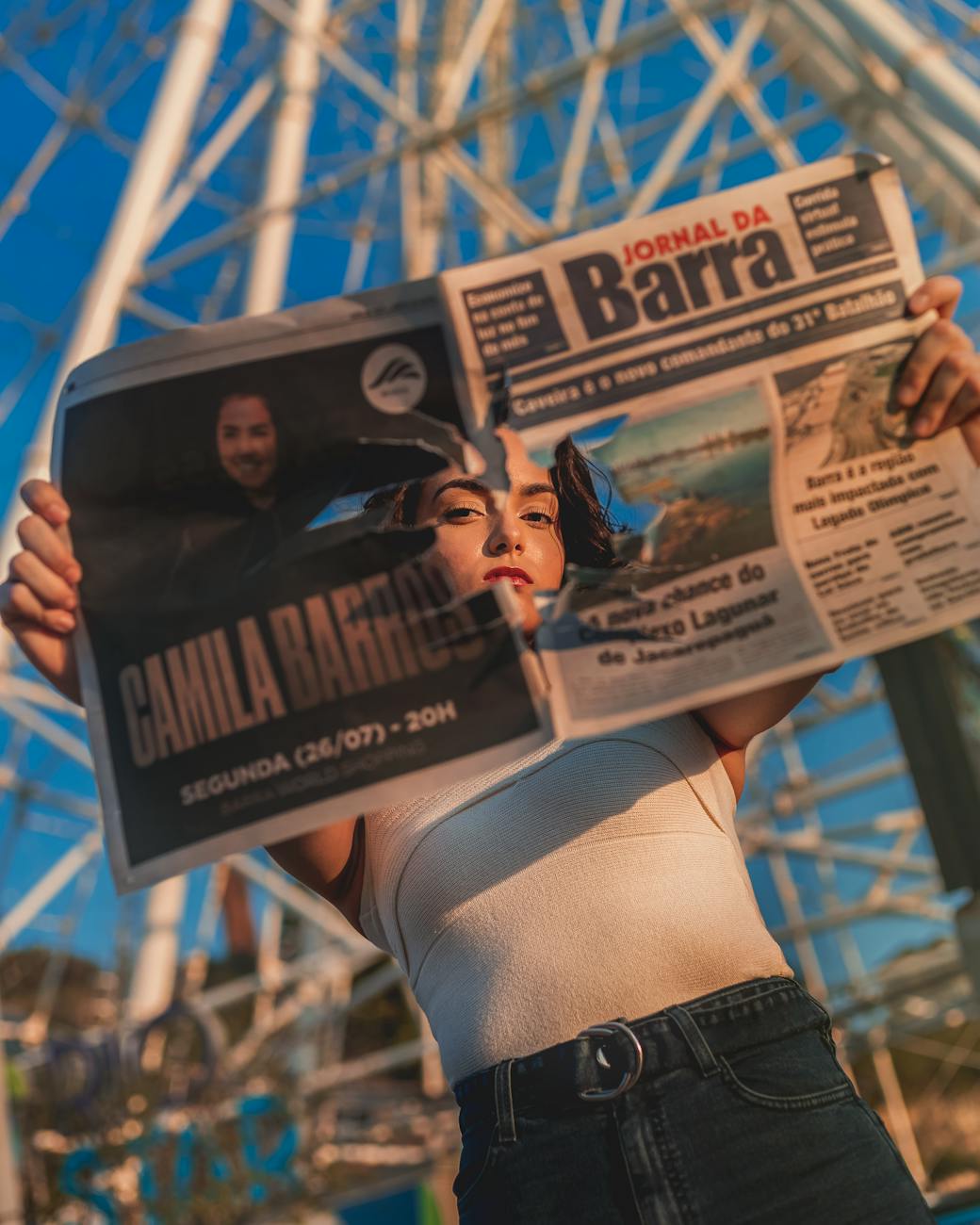 woman holding a newspaper with hole