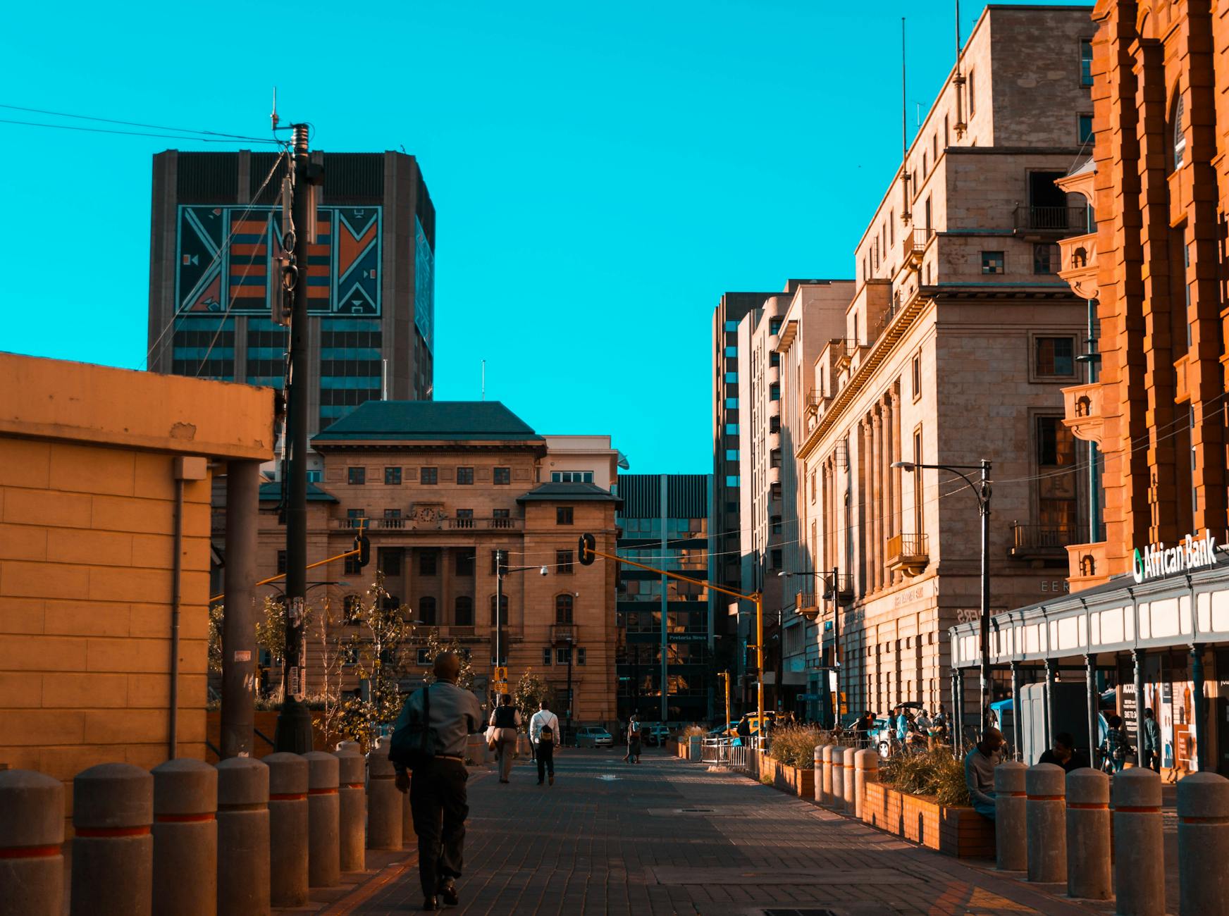 photo of people walking near buildings