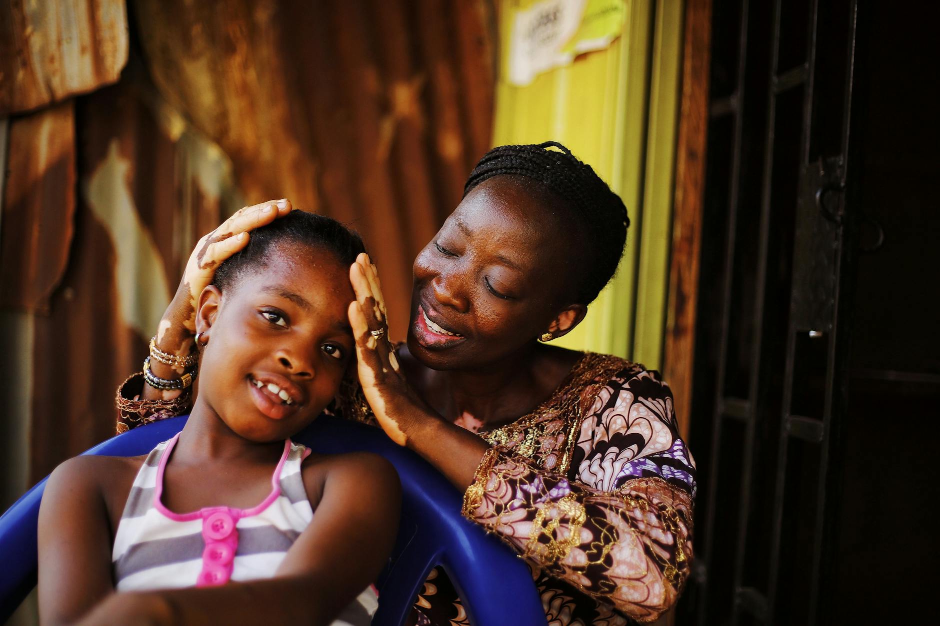 mother and daughter sharing a tender moment outdoors