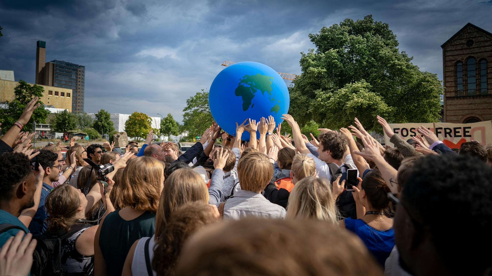 group of people doing a demonstration on global climate and environmental issues