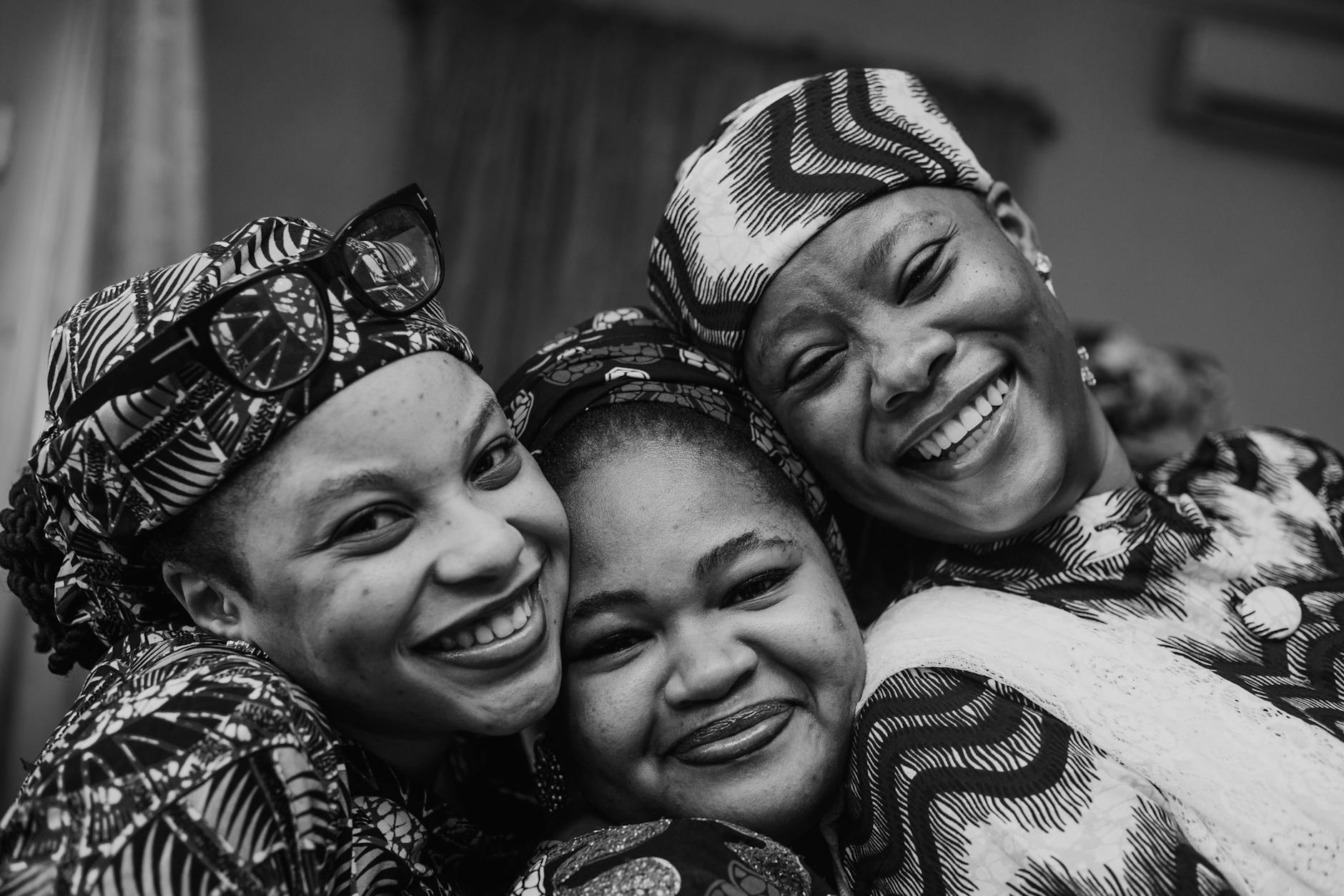 black and white portrait of women smiling