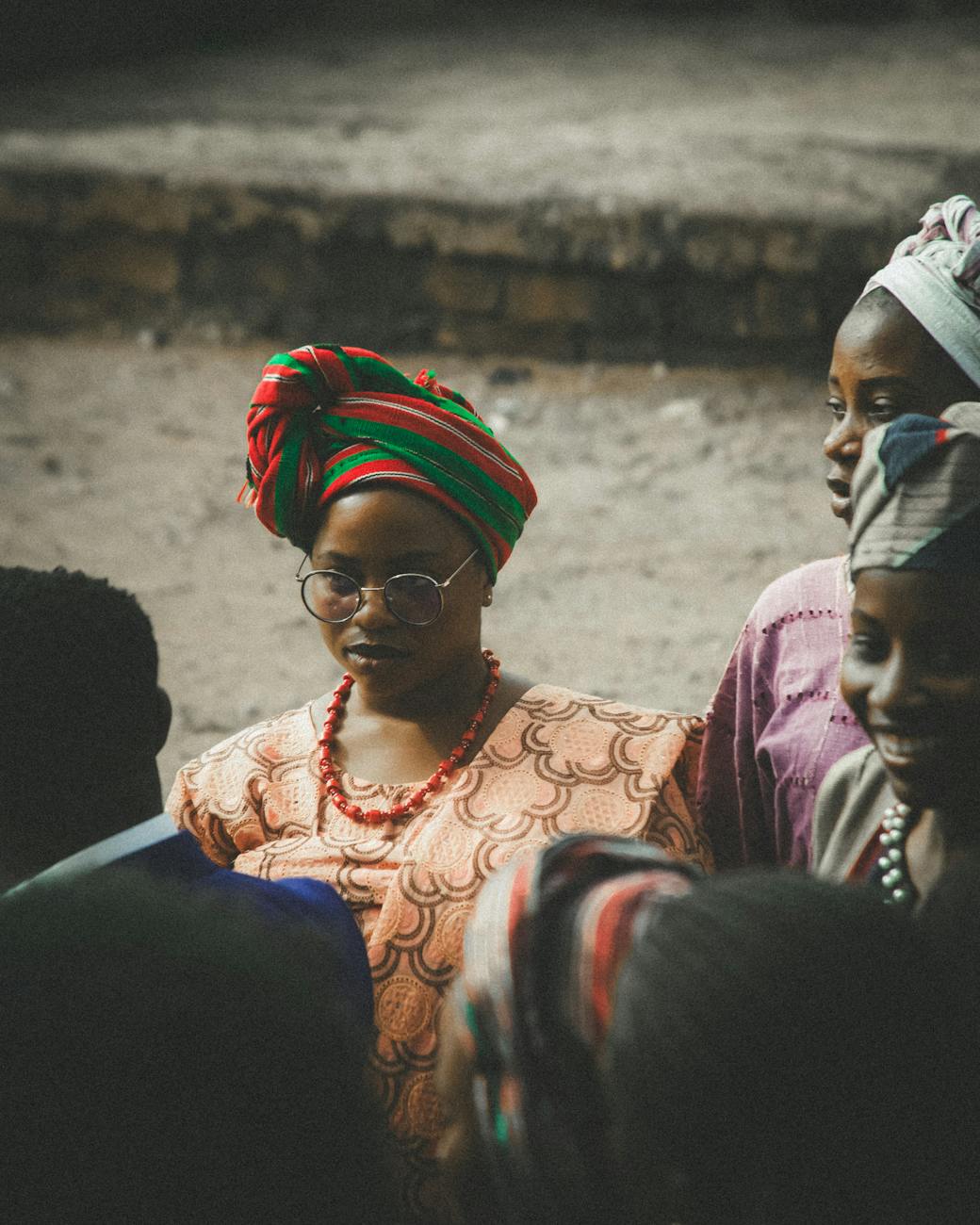 african women in traditional attire gathering