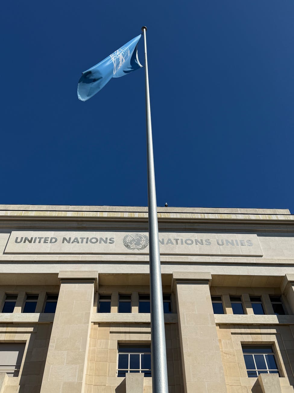 united nations headquarters in geneva with flag
