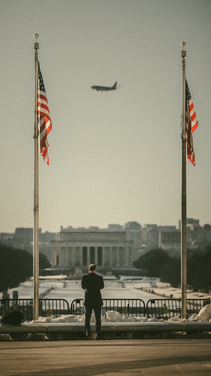 man at lincoln memorial with flying plane