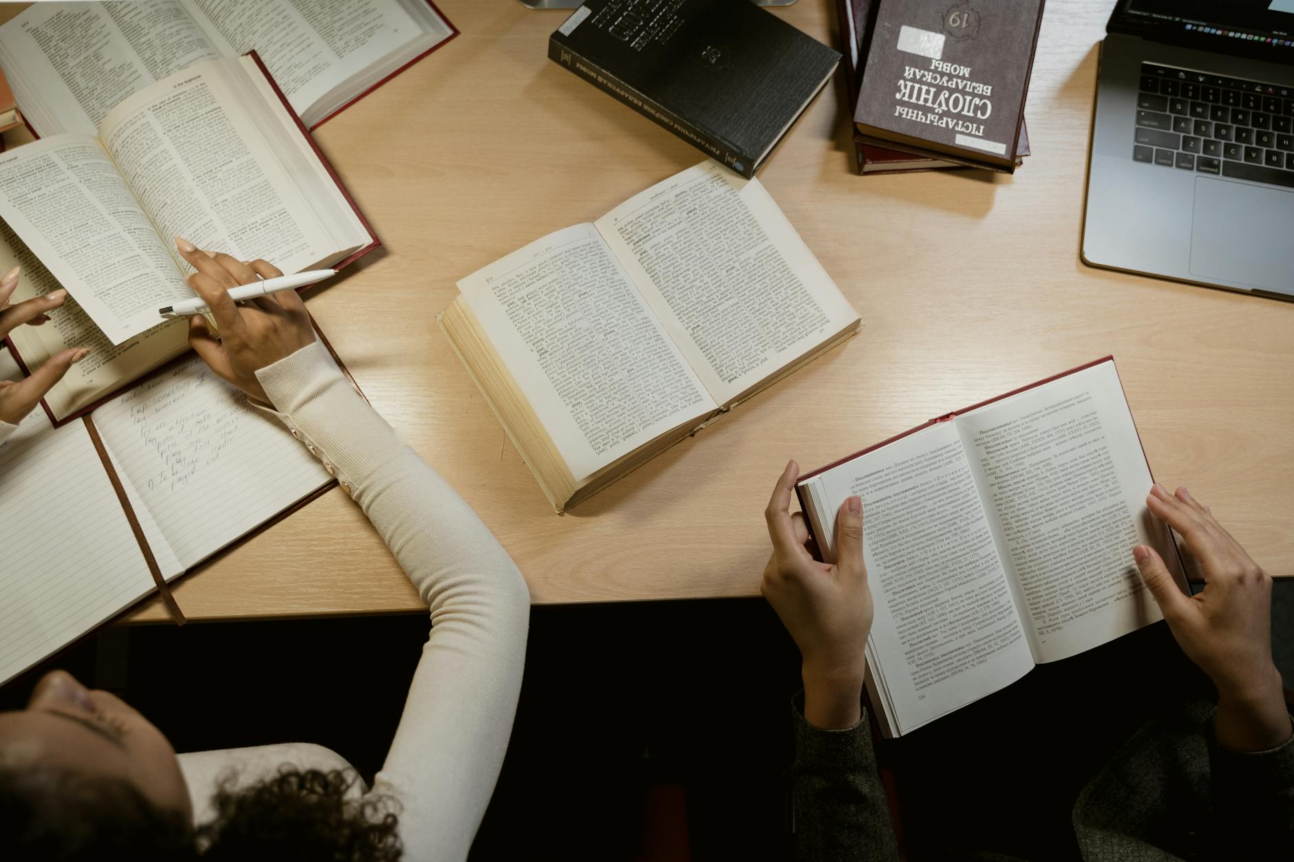 a top shot of people reading books