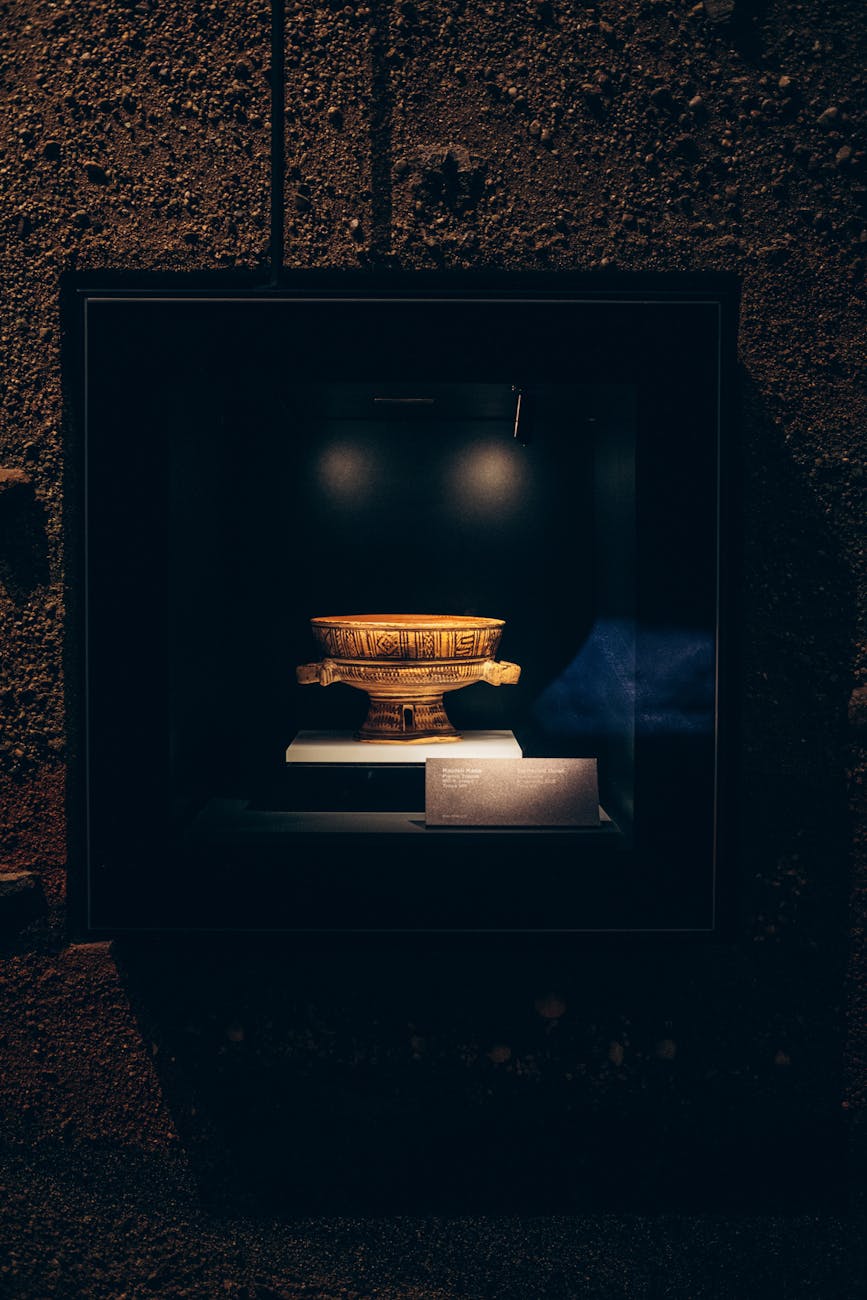 golden vase in box in museum