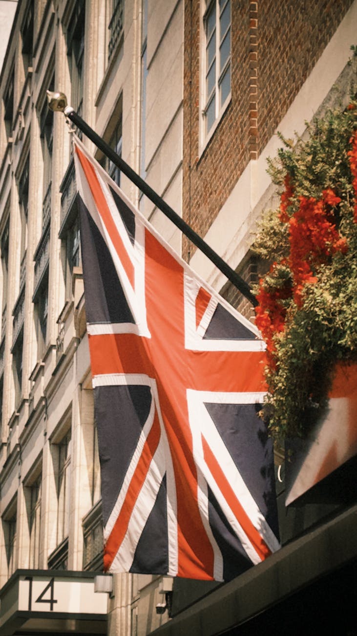union jack flag on city street building