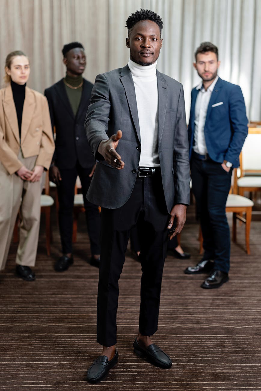 a man in front of group of people