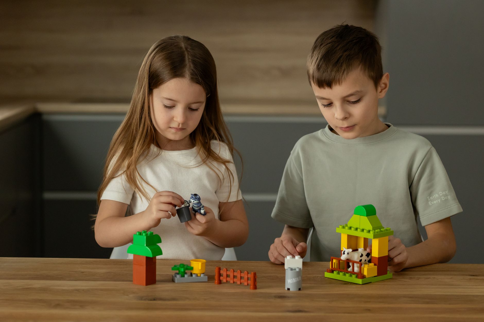 children engaged in creative play with building blocks
