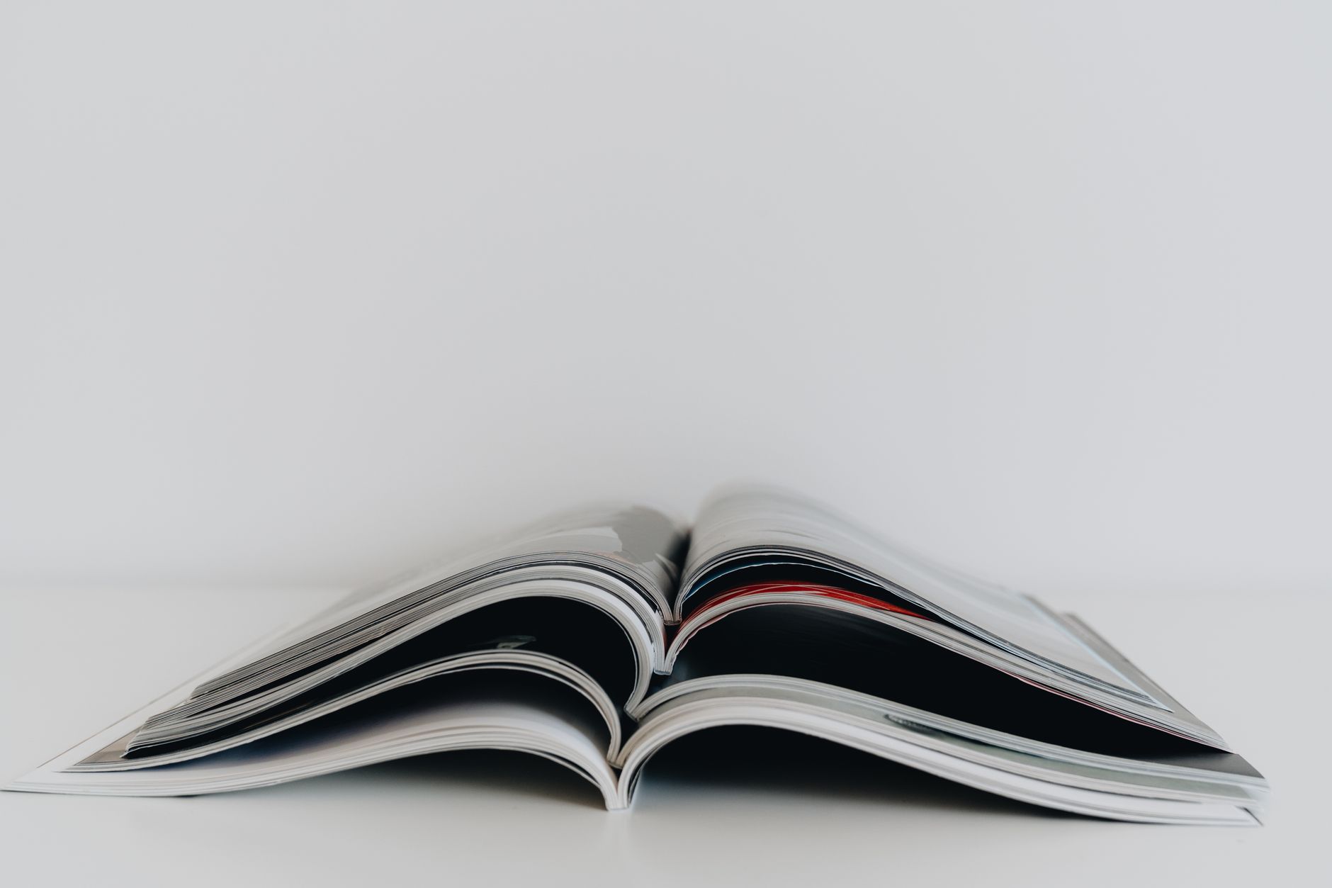 a stack of open magazines