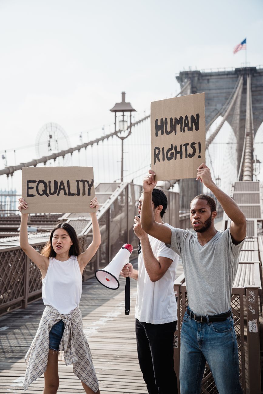 people holding protest posters