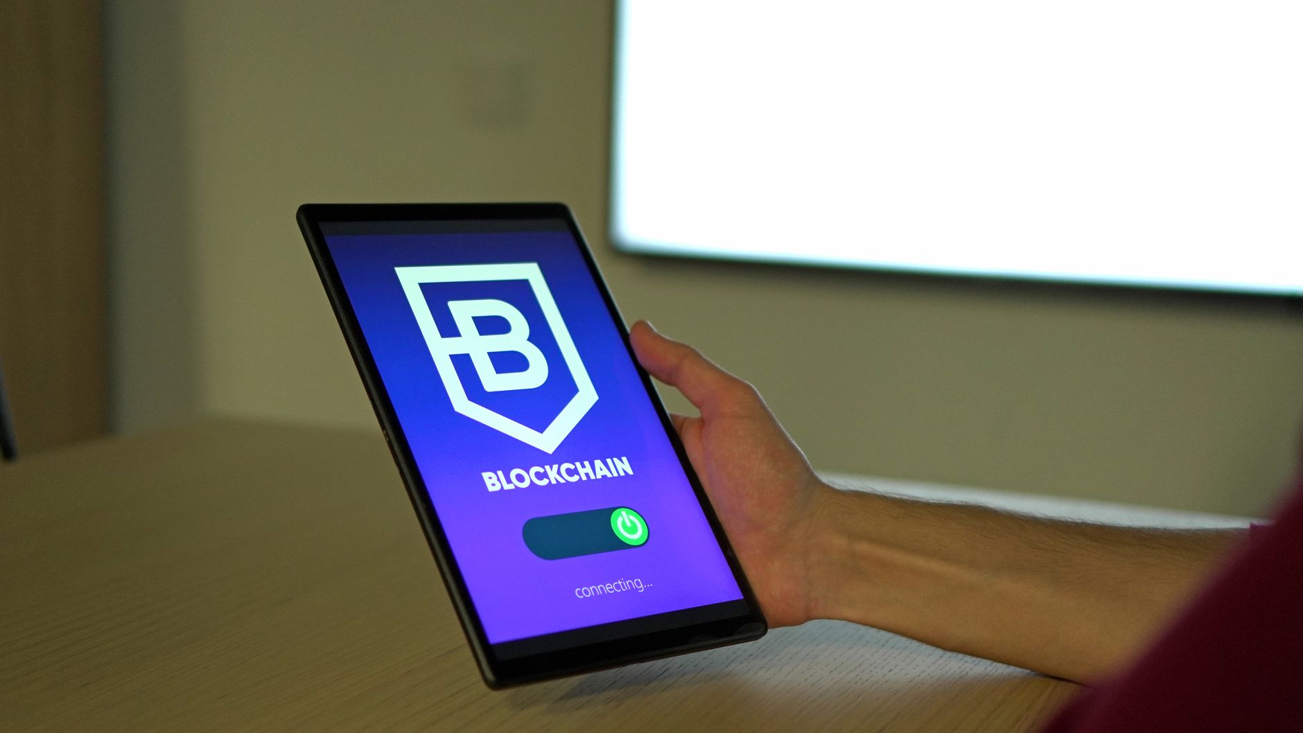 a person holding a digital tablet
