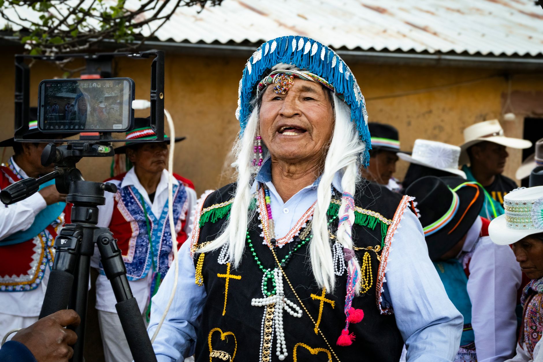 A traditional festival in Lari, Arequipa, Peru, featuring locals in vibrant cultural attire.