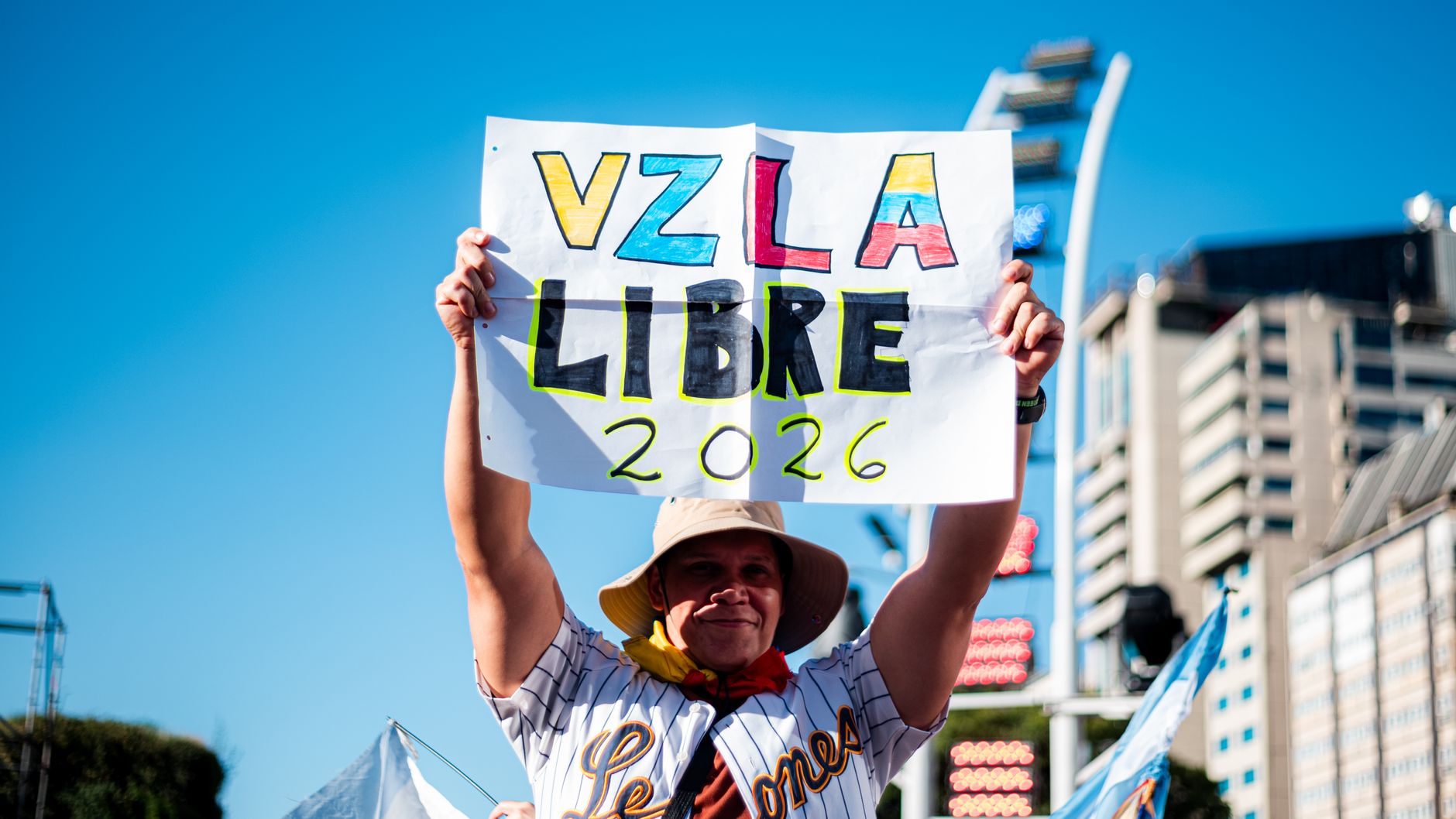 Venezuelan community in Buenos Aires celebrates freedom with signs and flags.