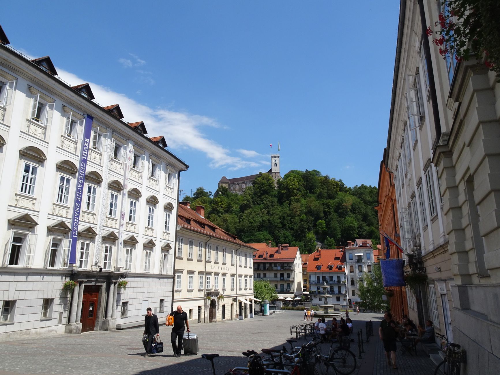Explore Ljubljana's historic architecture and stunning castle view on a sunny summer day.
