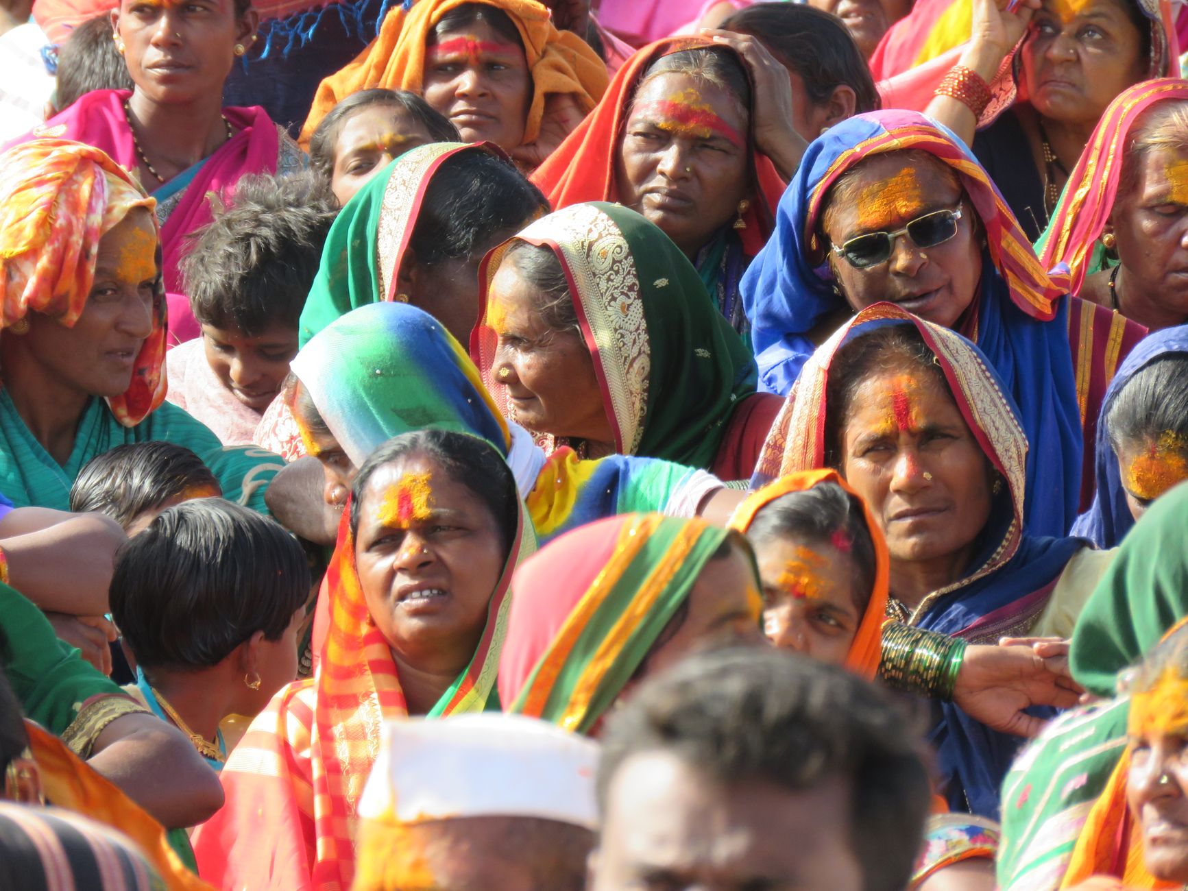 Group of individuals in colorful traditional attire during a cultural gathering.